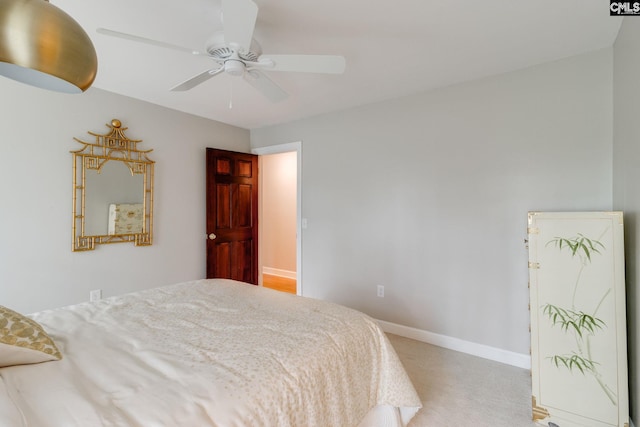 bedroom with baseboards, carpet, and a ceiling fan