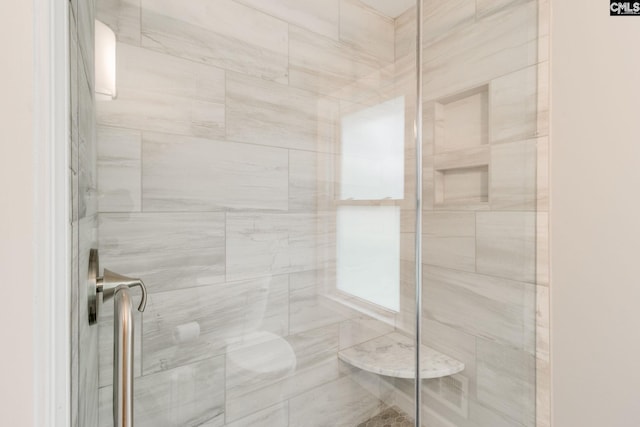 full bath featuring a shower stall