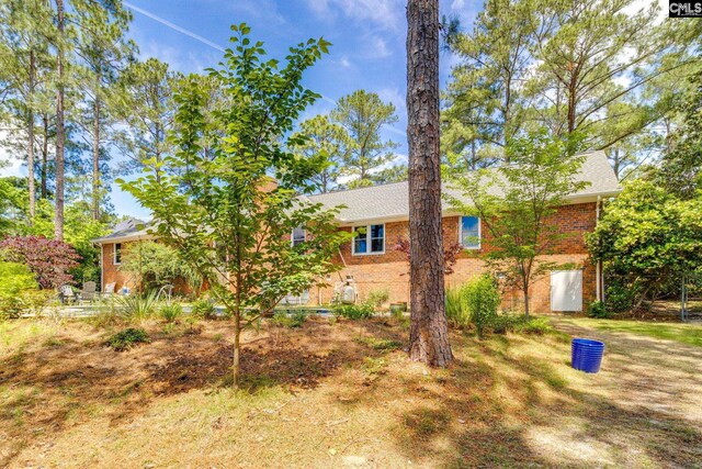 view of front of house featuring brick siding
