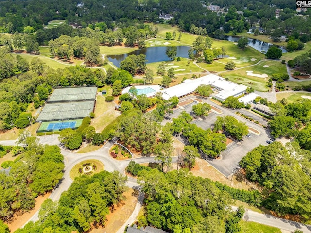 drone / aerial view of a nearby body of water and a golf club