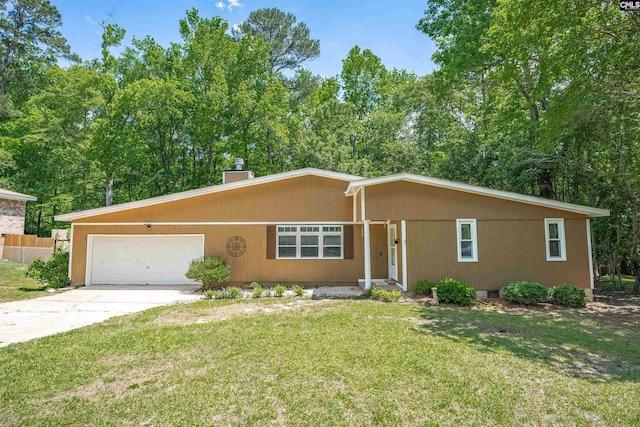 single story home with a garage, driveway, a front lawn, and a chimney