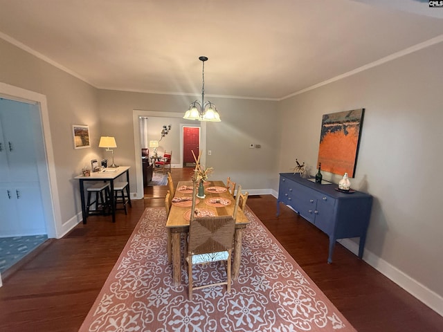 1006 W Main, Ridge Spring, SC 29129 - dining space featuring dark wood finished floors, crown molding, baseboards, and a chandelier