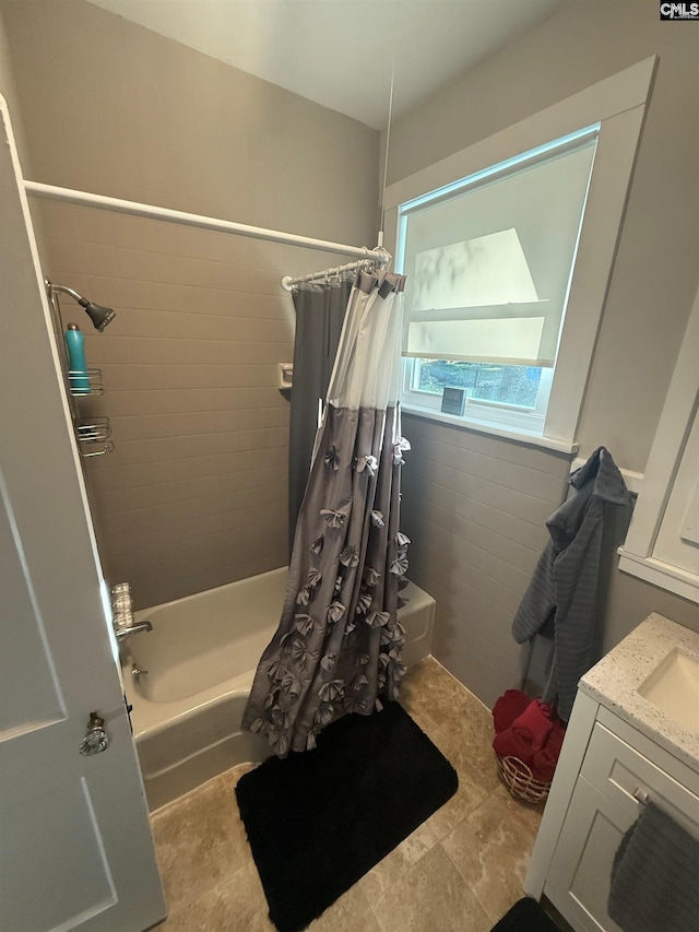 1006 W Main, Ridge Spring, SC 29129 - full bath with shower / tub combo, vanity, and tile walls