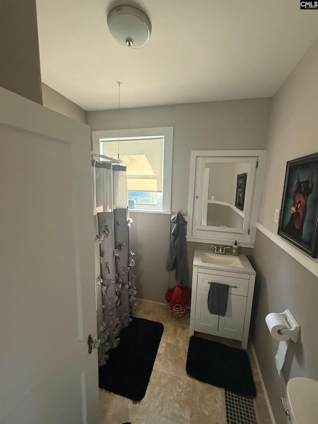 1006 W Main, Ridge Spring, SC 29129 - bathroom with a shower with curtain, vanity, and toilet
