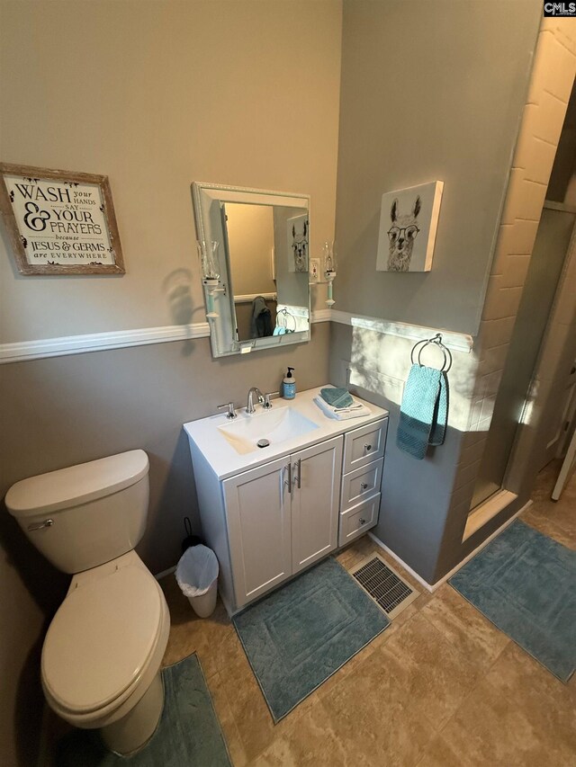 1006 W Main, Ridge Spring, SC 29129 - bathroom featuring a stall shower, toilet, and vanity
