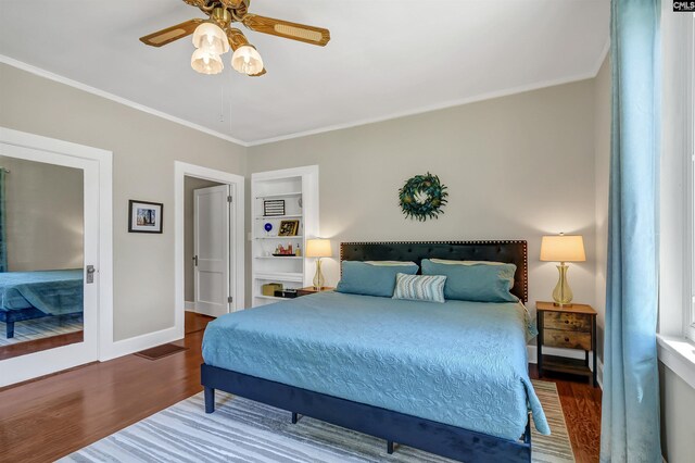 1006 W Main, Ridge Spring, SC 29129 - bedroom with wood finished floors, ornamental molding, baseboards, and ceiling fan