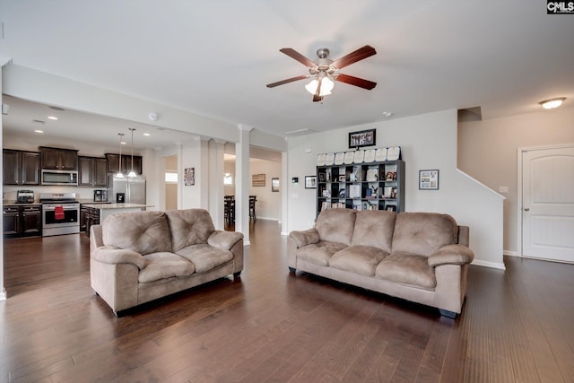 living room featuring a ceiling fan, dark wood-style floors, recessed lighting, and baseboards