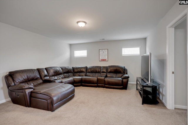living room with carpet floors, plenty of natural light, and baseboards