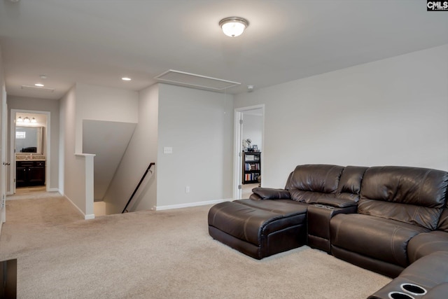 carpeted living room featuring attic access, baseboards, and recessed lighting