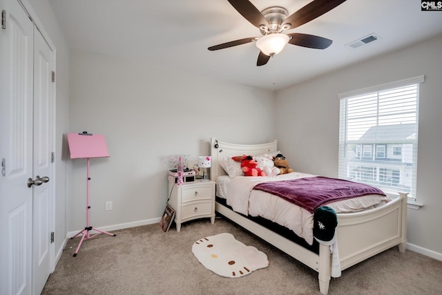 bedroom featuring carpet, baseboards, and a ceiling fan