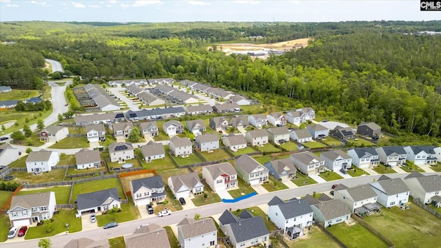 aerial view of residential area with a forest
