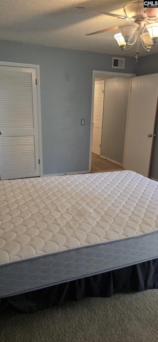 unfurnished bedroom featuring a ceiling fan