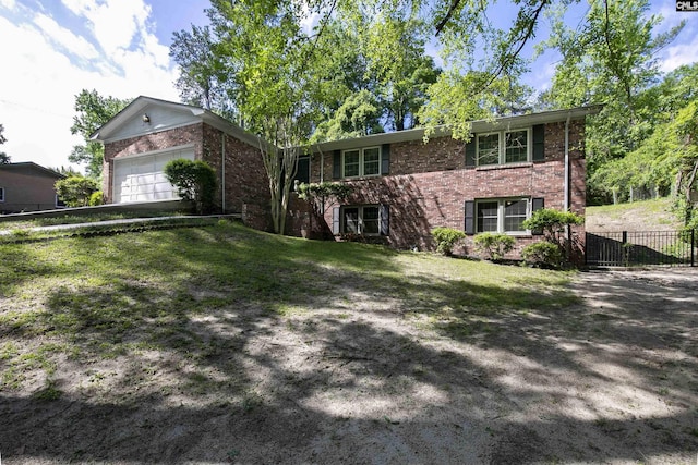 view of front facade featuring brick siding, a garage, and driveway
