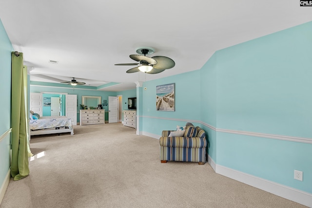 unfurnished bedroom featuring carpet floors, baseboards, and a ceiling fan