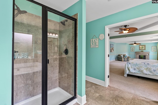 bathroom featuring connected bathroom, a shower stall, ceiling fan, and baseboards