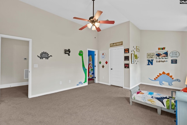 playroom with carpet floors, a ceiling fan, baseboards, and high vaulted ceiling