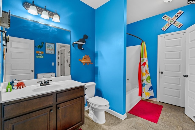 bathroom featuring toilet, shower / tub combo, and vanity