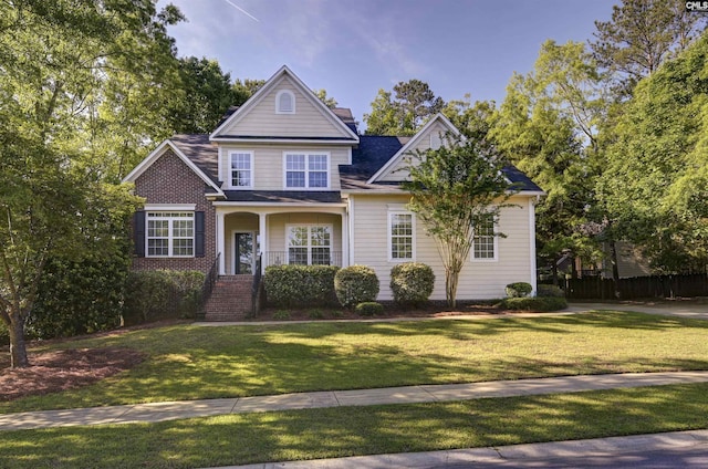 5 Stonewall Ct, Irmo, SC 29063 - view of front of home with a front yard, brick siding, and roof with shingles