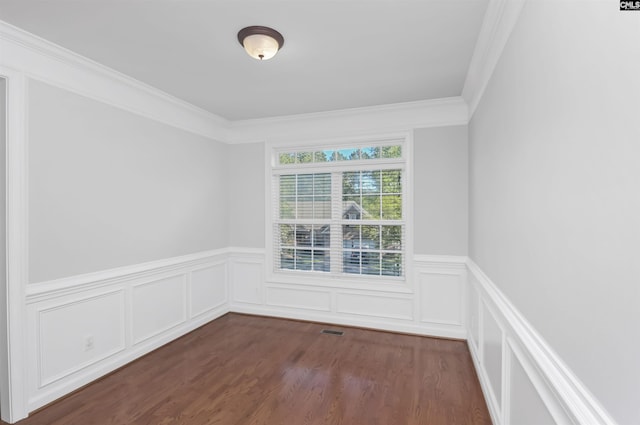 5 Stonewall Ct, Irmo, SC 29063 - empty room featuring crown molding, a wainscoted wall, dark wood-type flooring, and a decorative wall