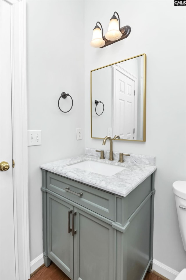 5 Stonewall Ct, Irmo, SC 29063 - bathroom with vanity, toilet, wood finished floors, and baseboards
