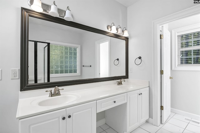 5 Stonewall Ct, Irmo, SC 29063 - bathroom with tile patterned flooring, double vanity, and baseboards