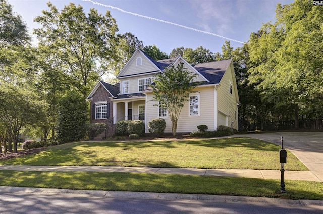 5 Stonewall Ct, Irmo, SC 29063 - traditional-style house featuring a garage, driveway, a front yard, and covered porch