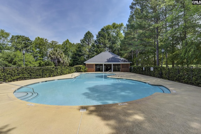 5 Stonewall Ct, Irmo, SC 29063 - community pool with fence, a patio area, and view of wooded area