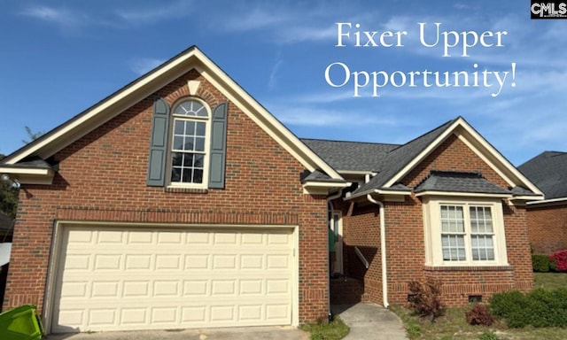 view of front of home featuring brick siding, concrete driveway, crawl space, and a garage