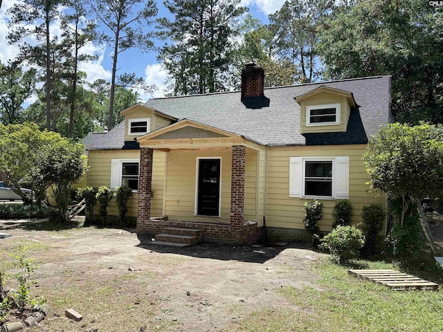 1611 W Buchanan Dr, Columbia, SC 29206 - new england style home with a chimney and roof with shingles