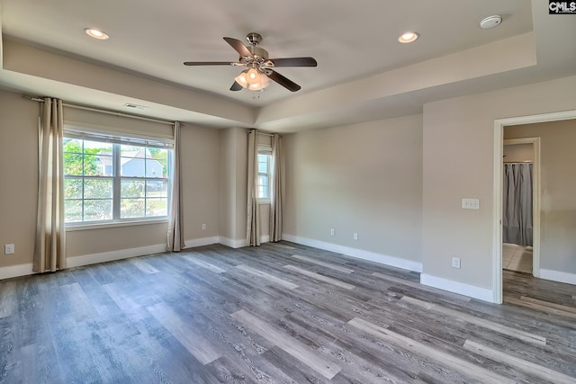 unfurnished room with ceiling fan, wood finished floors, recessed lighting, baseboards, and a smoke detector