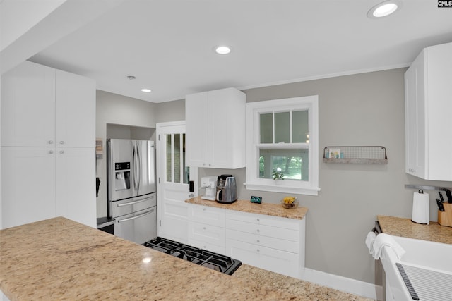 3803 Yale Ave, Columbia, SC 29205 - kitchen with stainless steel refrigerator with ice dispenser, white cabinets, recessed lighting, and baseboards