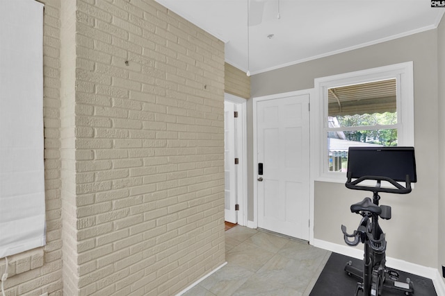 3803 Yale Ave, Columbia, SC 29205 - exercise area with crown molding, brick wall, baseboards, and ceiling fan