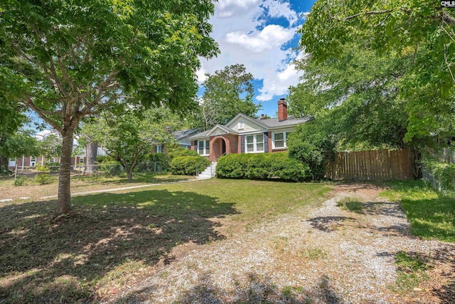 3803 Yale Ave, Columbia, SC 29205 - view of front of home with a chimney, brick siding, and driveway