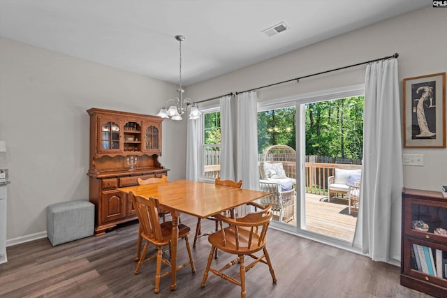 255 Honey Hill Way, Blythewood, SC 29016 - dining area featuring a chandelier, dark wood-style flooring, and baseboards