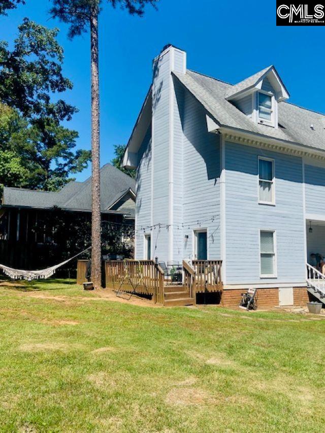 319 Mooring Ln, Lexington, SC 29072 - rear view of house with a deck, a lawn, and a chimney