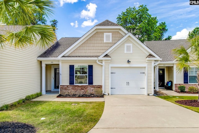 146 Sabal Dr, West Columbia, SC 29169 - view of front of home featuring a garage, driveway, roof with shingles, stone siding, and a front lawn