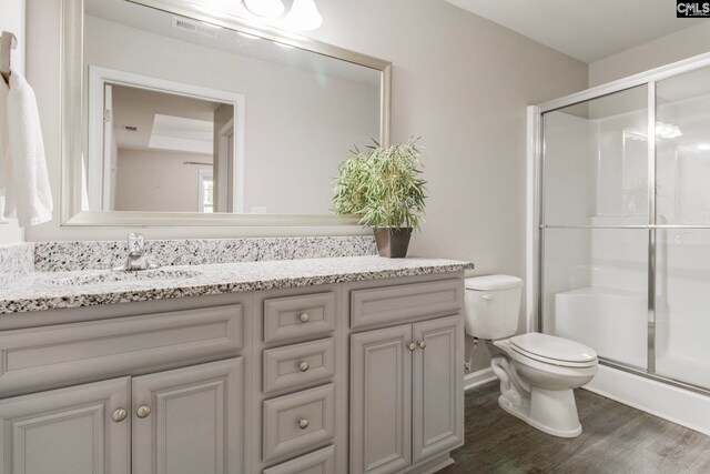 146 Sabal Dr, West Columbia, SC 29169 - bathroom featuring toilet, wood finished floors, a shower stall, and vanity