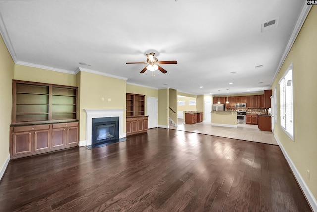 305 Thoroughbred Way, Columbia, SC 29045 - unfurnished living room featuring a fireplace with flush hearth, wood finished floors, plenty of natural light, ceiling fan, and ornamental molding