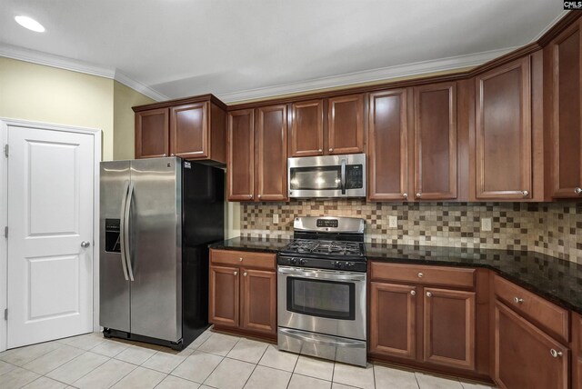 305 Thoroughbred Way, Columbia, SC 29045 - kitchen featuring appliances with stainless steel finishes, crown molding, light tile patterned floors, backsplash, and dark stone countertops