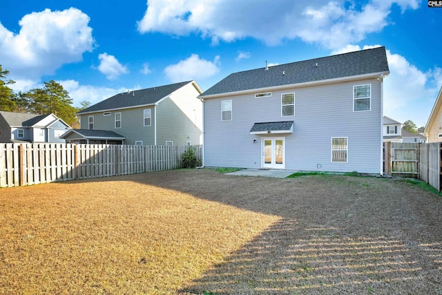 rear view of property with french doors and a patio area