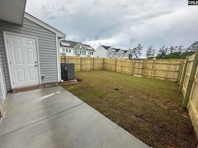 2040 Skyline Rd, Columbia, SC 29229 - view of yard featuring a patio area, central AC unit, and a residential view