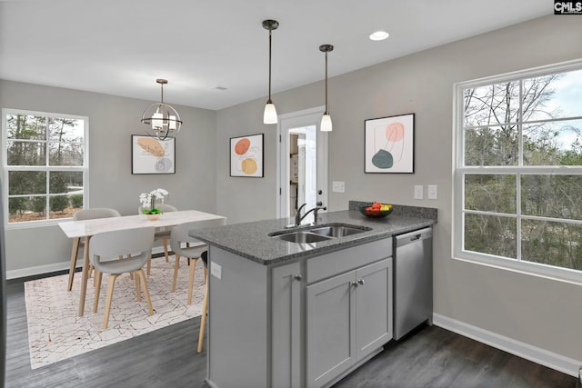 2040 Skyline Rd, Columbia, SC 29229 - kitchen with dishwasher, a sink, a peninsula, baseboards, and dark wood-type flooring