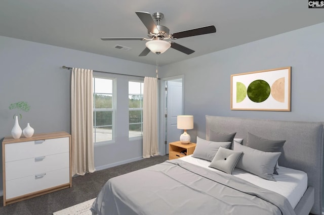 2040 Skyline Rd, Columbia, SC 29229 - bedroom with dark colored carpet, a ceiling fan, and baseboards