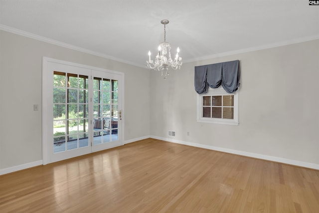 604 Shady Ln, Cayce, SC 29033 - empty room featuring a chandelier, wood finished floors, ornamental molding, and baseboards