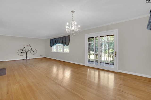 604 Shady Ln, Cayce, SC 29033 - unfurnished living room featuring healthy amount of natural light, a chandelier, baseboards, and crown molding