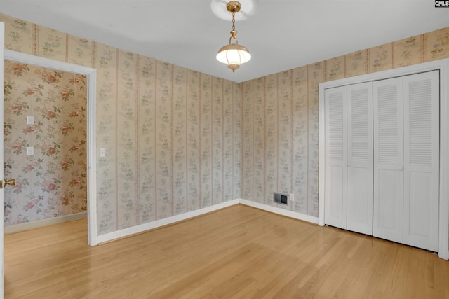 604 Shady Ln, Cayce, SC 29033 - unfurnished bedroom with wood finished floors, a closet, and baseboards