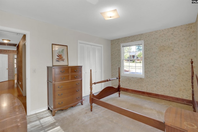 604 Shady Ln, Cayce, SC 29033 - bedroom with baseboards, wallpapered walls, a closet, and light carpet