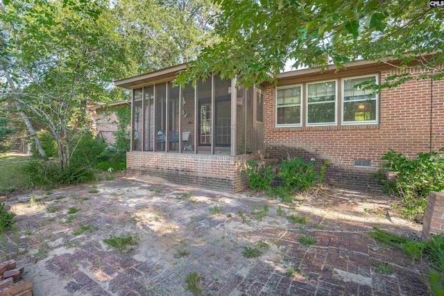604 Shady Ln, Cayce, SC 29033 - rear view of house with crawl space, a sunroom, and brick siding
