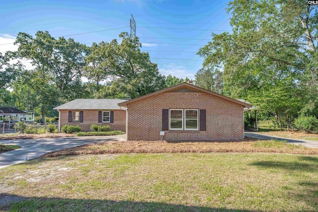604 Shady Ln, Cayce, SC 29033 - ranch-style house with brick siding, a front yard, and driveway