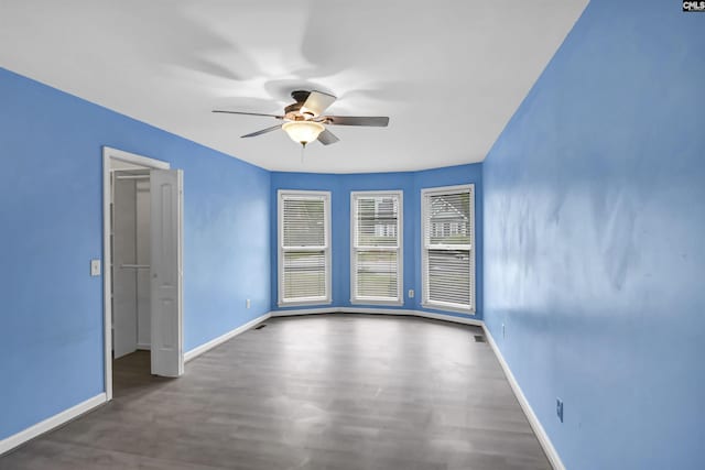 105 Golden Pond Dr, Lexington, SC 29073 - empty room featuring a ceiling fan, wood finished floors, and baseboards
